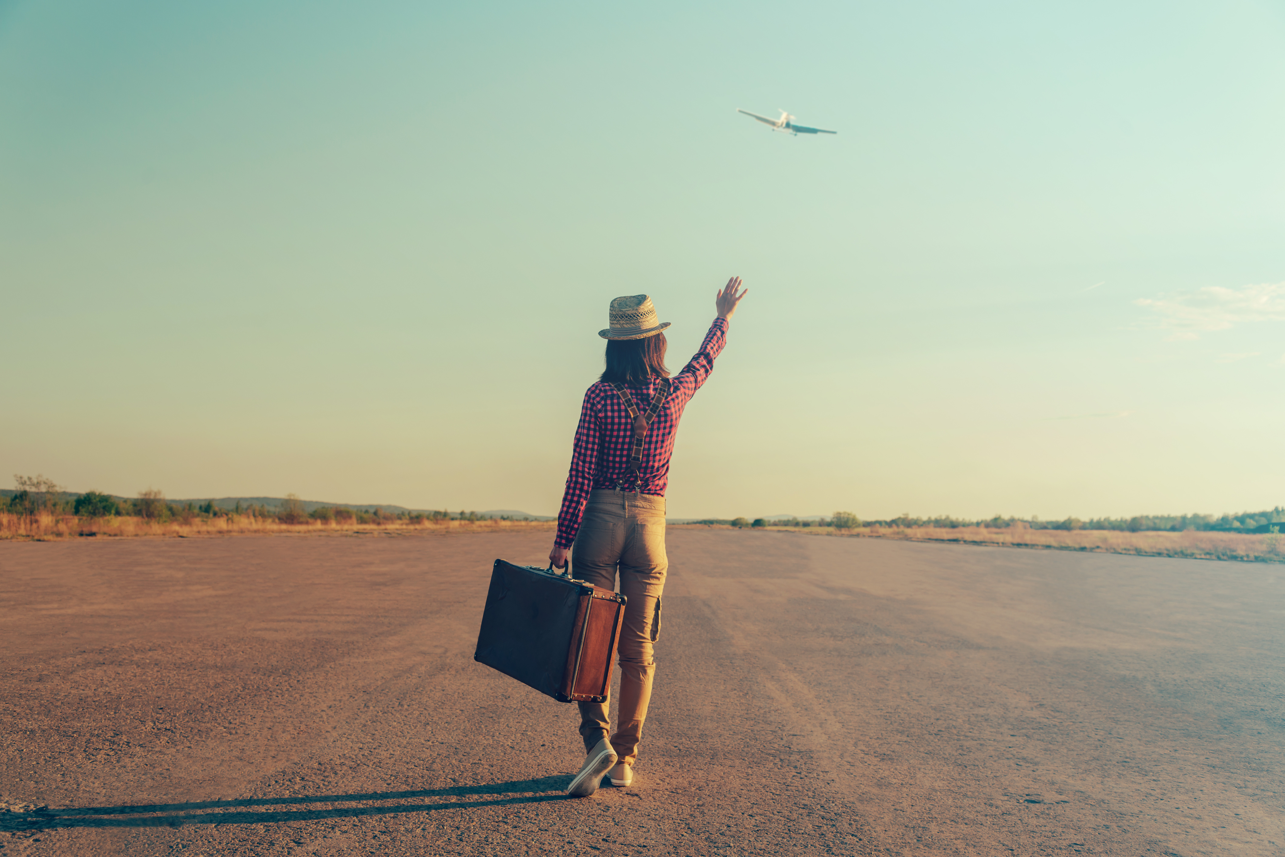 waving goodbye to plane