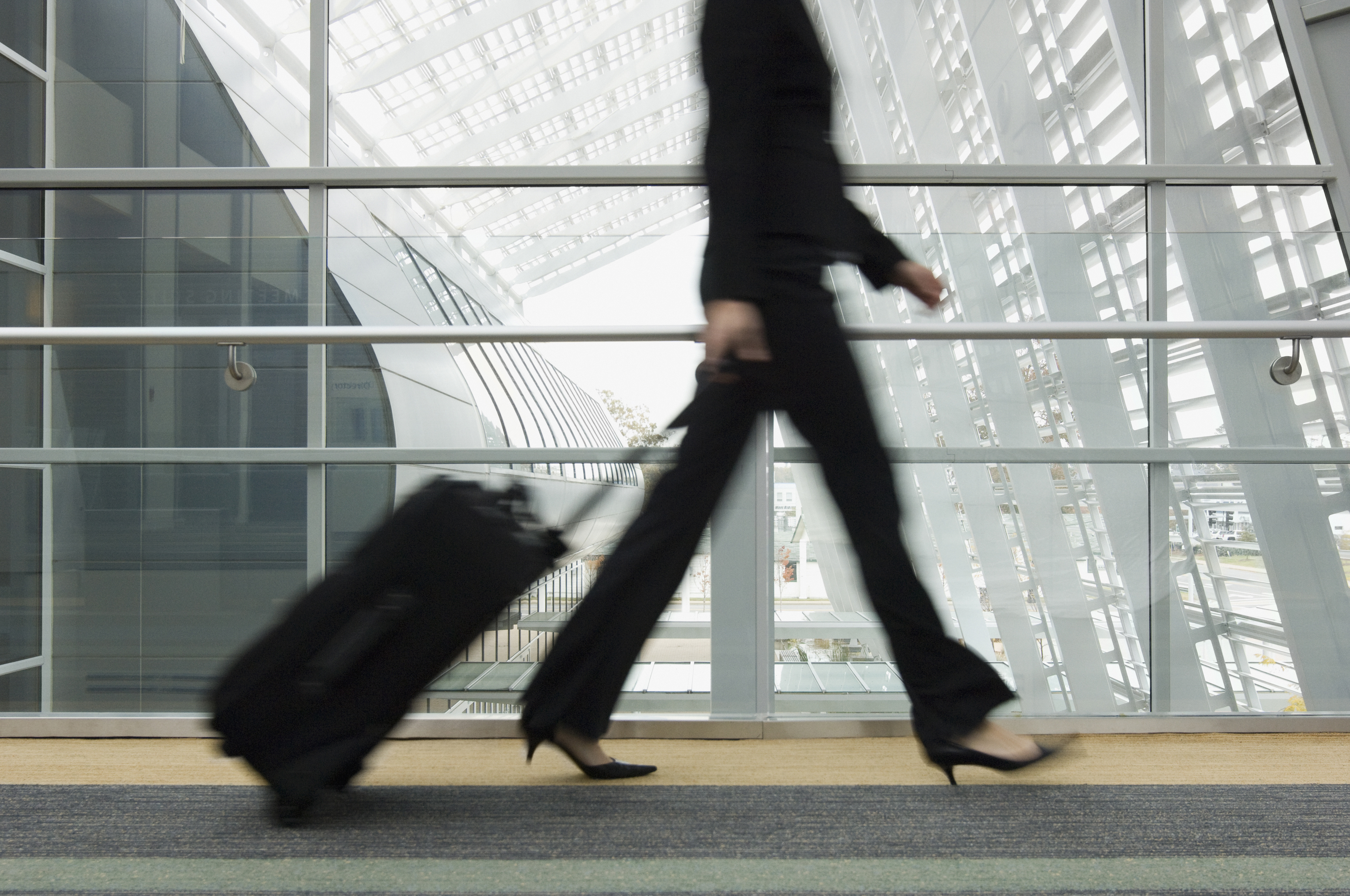 woman walking high heels airport